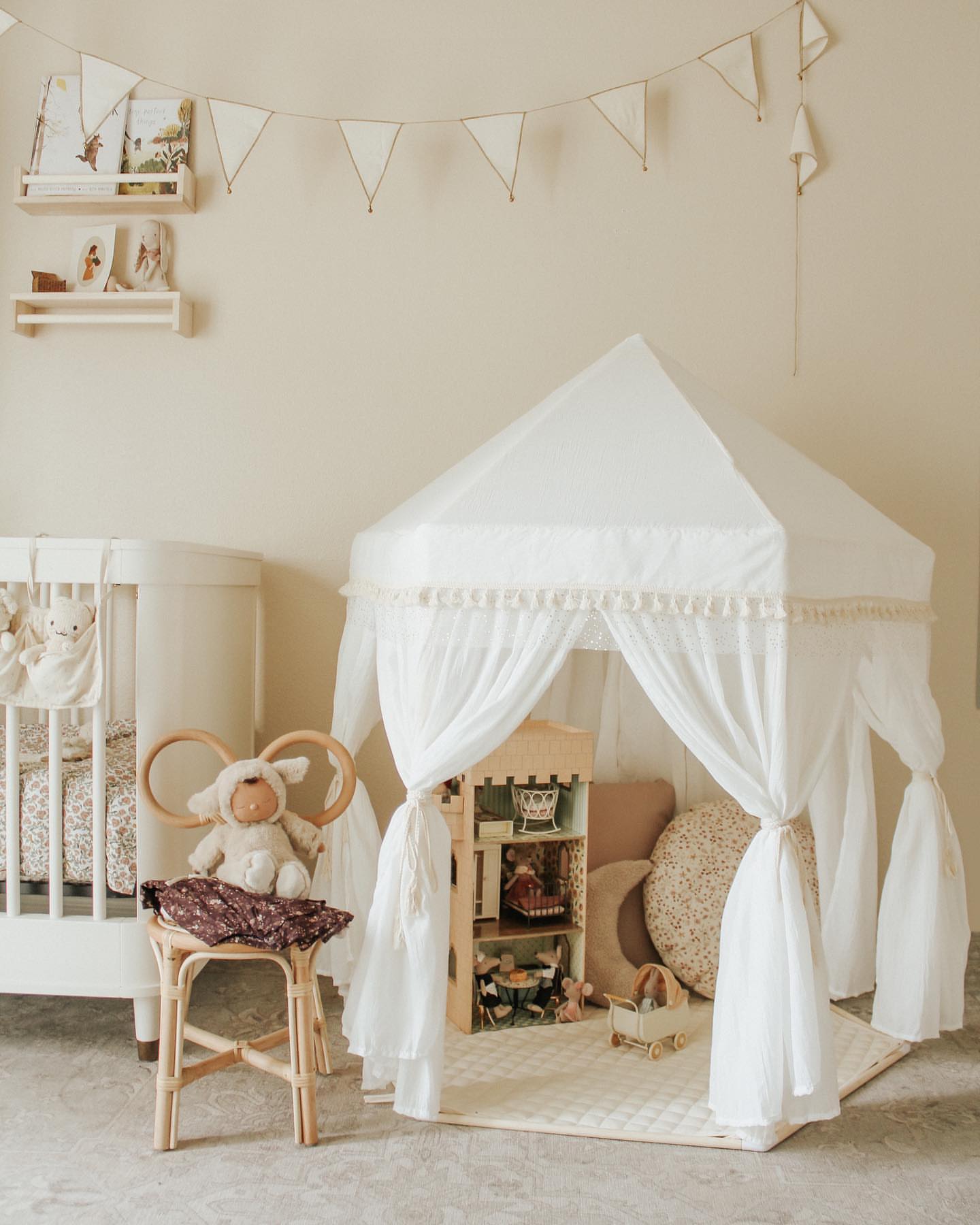 playroom with whimsical white play tent and furniture 